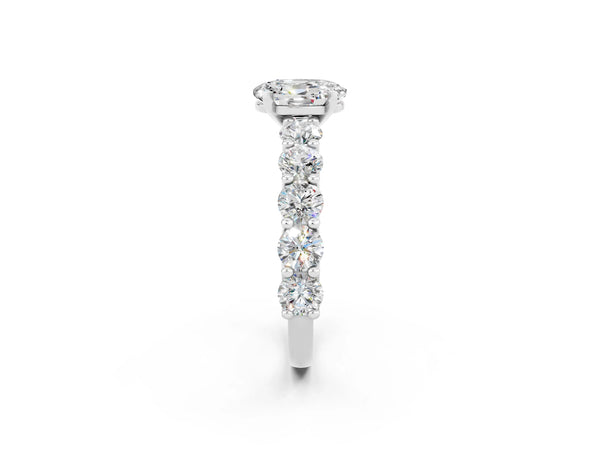Silver Oval Cut Moissanite Prong Setting with Side Stones on a Pave Band