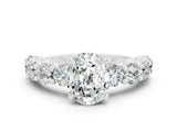 White gold Oval Cut Moissanite Prong Setting with Side Stones on a Pave Band