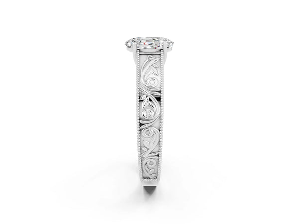 Platinum Oval Cut Moissanite Solitaire Ring with Engraved Band and Four-Prong Setting