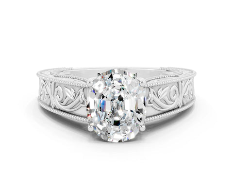 White gold Oval Cut Moissanite Solitaire Ring with Engraved Band and Four-Prong Setting