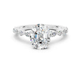 White gold Oval Cut Moissanite Solitaire with Side Stones on a Pavé Band and Four-Prong Setting