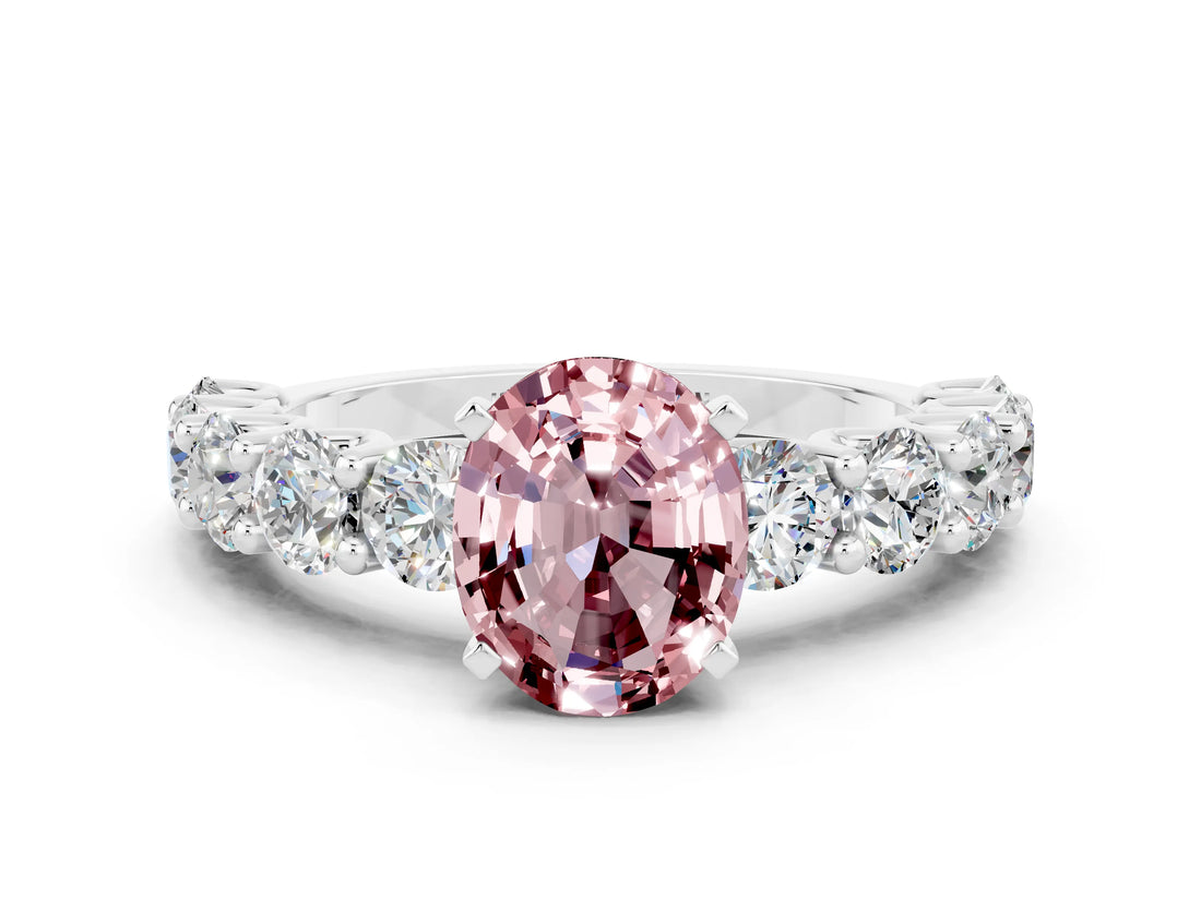 White gold Oval Cut Morganite Prong Setting with Side Stones on a Pave Band