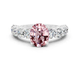 White gold Oval Cut Morganite Prong Setting with Side Stones on a Pave Band