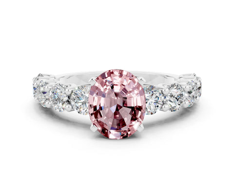 White gold Oval Cut Morganite Prong Setting with Side Stones on a Pave Band