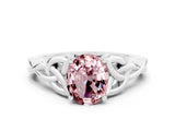 White gold Oval Cut Morganite Solitaire Engagement Ring with Celtic Knot Band and Four-Prong Setting