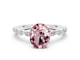 White gold Oval Cut Morganite Solitaire with Side Stones on a Pavé Band and Four-Prong Setting