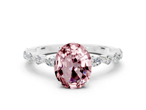 White gold Oval Cut Morganite Solitaire with Side Stones on a Pavé Band and Four-Prong Setting