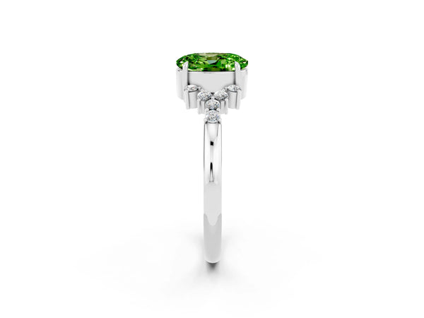 Silver Oval Cut Peridot Ring with Side Stones and Four-Prong Setting