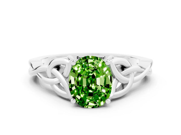 White gold Oval Cut Peridot Solitaire Celtic Knot Ring with Four-Prong Setting