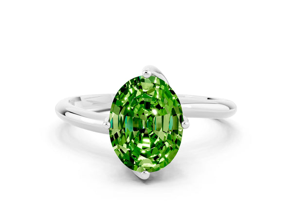 Silver Oval Cut Peridot Solitaire Engagement Ring with Four-Prong Setting and Classic Band