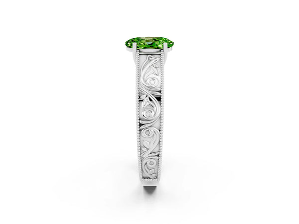 Platinum Oval Cut Peridot Solitaire Ring with Engraved Band and Four-Prong Setting