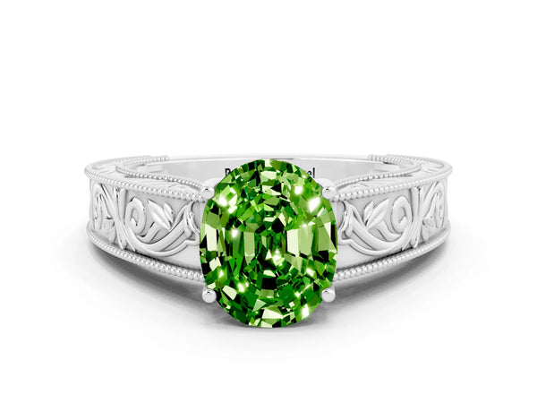 White gold Oval Cut Peridot Solitaire Ring with Engraved Band and Four-Prong Setting