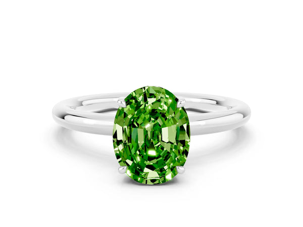 Platinum Oval Cut Peridot Solitaire Ring with Thin Band and Four-Prong Setting