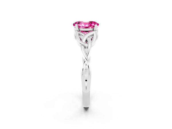 Platinum Oval Cut Pink Sapphire Solitaire Engagement Ring with Celtic Knot Band and Four-Prong Setting