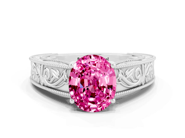 Platinum Oval Cut Pink Sapphire Solitaire Ring with Engraved Band and Four-Prong Setting