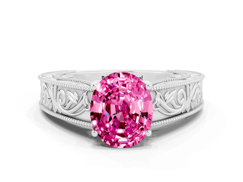 White gold Oval Cut Pink Sapphire Solitaire Ring with Engraved Band and Four-Prong Setting