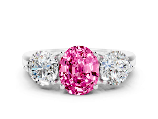 Platinum Oval Cut Pink Sapphire Three-Stone Ring with Prong Setting and Classic Band