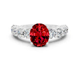 White gold Oval Cut Ruby Prong Setting with Side Stones on a Pave Band