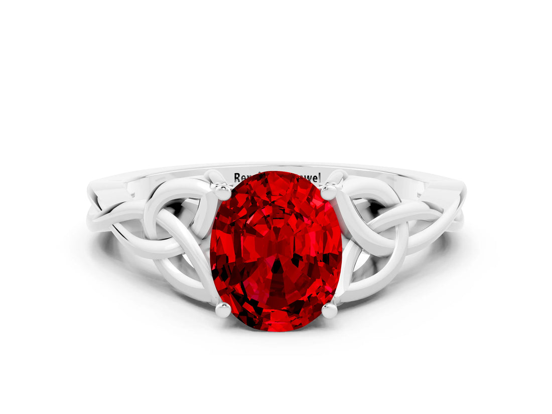 White gold Oval Cut Ruby Solitaire Engagement Ring with Celtic Knot Band and Four-Prong Setting