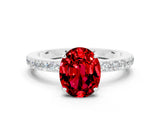 White gold Oval Cut Ruby Solitaire Engagement Ring with Pavé Band and Four-Prong Setting