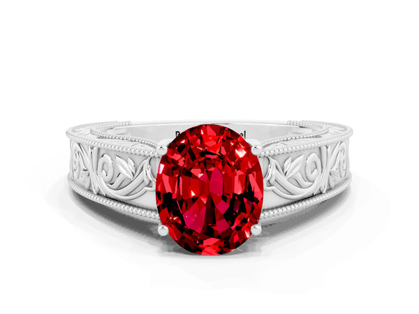 Platinum Oval Cut Ruby Solitaire Ring with Engraved Band and Four-Prong Setting
