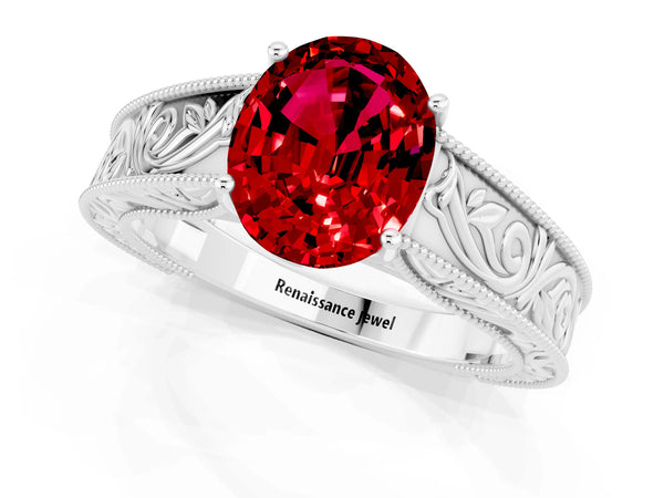 Silver Oval Cut Ruby Solitaire Ring with Engraved Band and Four-Prong Setting