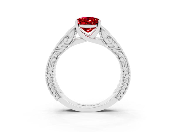 Silver Oval Cut Ruby Solitaire Ring with Engraved Band and Four-Prong Setting