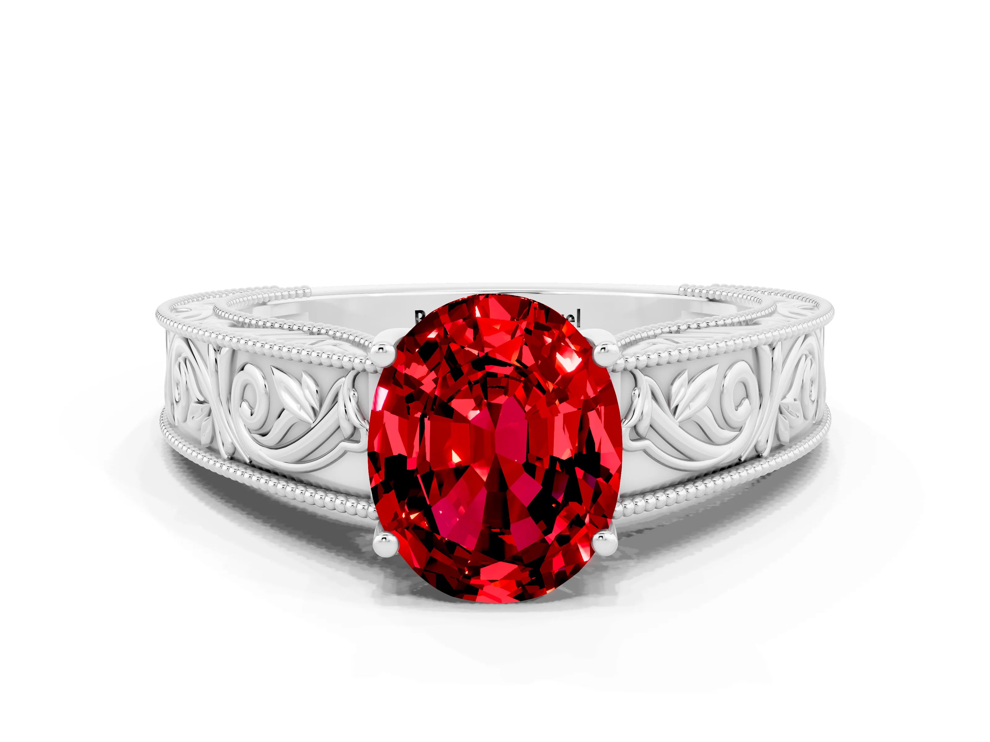 White gold Oval Cut Ruby Solitaire Ring with Engraved Band and Four-Prong Setting