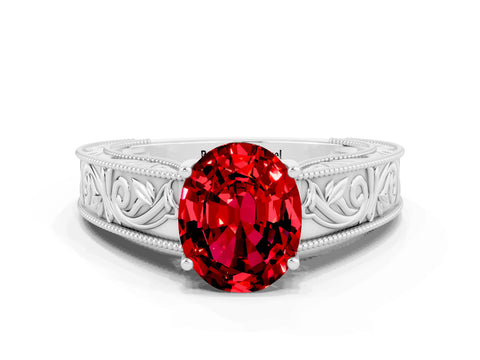 White gold Oval Cut Ruby Solitaire Ring with Engraved Band and Four-Prong Setting