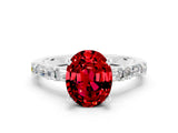 White gold Oval Cut Ruby Solitaire with Side Baguettes and Channel Set Band
