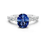 White gold Oval Cut Solitaire Blue Sapphire Ring with Pave Band and Four-Prong Setting