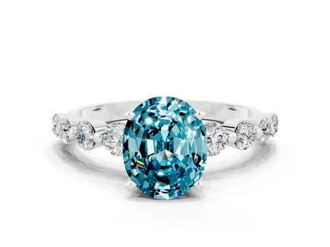White gold Oval Cut Solitaire Blue Topaz Ring with Pave Band and Four-Prong Setting