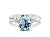 White gold Oval Cut Solitaire Diamond Engagement Ring with Twisted Pave Band and Four-Prong Setting