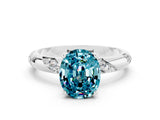 White gold Oval Cut Solitaire Diamond Engagement Ring with Twisted Pave Band and Four-Prong Setting