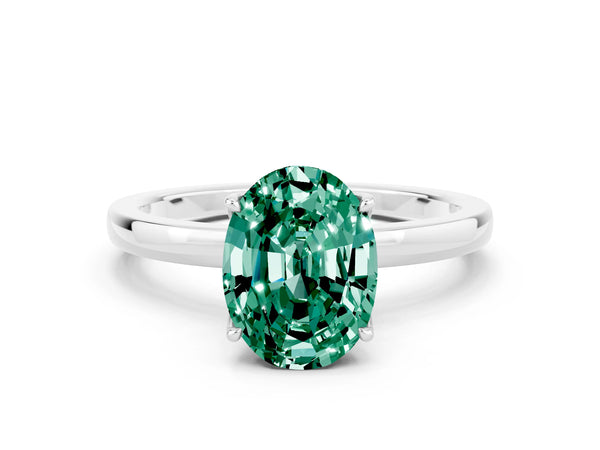Platinum Oval Cut Green Sapphire Solitaire Ring with Thin Band and Prong Setting