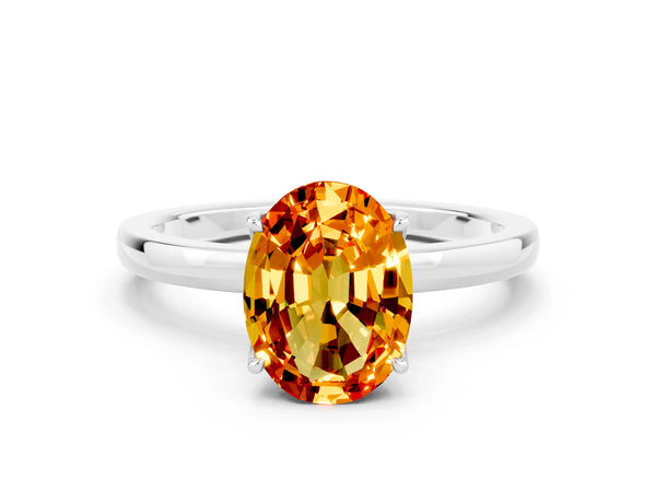 Platinum Oval Cut Citrine Solitaire Ring with Thin Band and Prong Setting