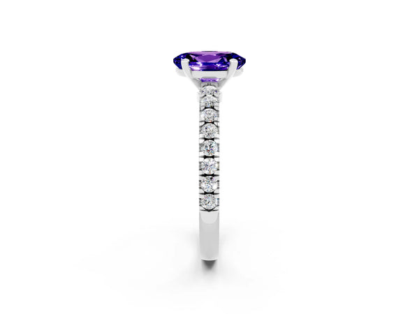 Platinum Oval Cut Solitaire Tanzanite with Pavé Band and Four-Prong Setting