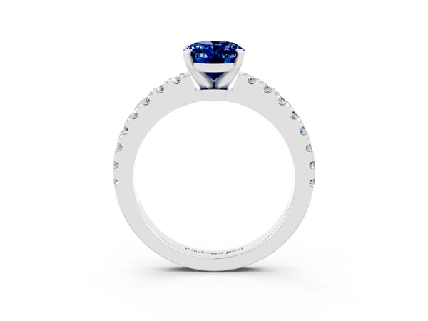 Platinum Oval Cut Solitaire Blue Sapphire with Pavé Band and Four-Prong Setting