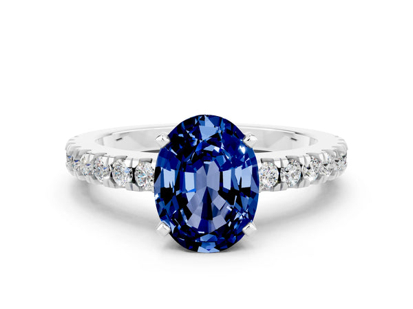 White gold Oval Cut Solitaire Blue Sapphire with Pavé Band and Four-Prong Setting