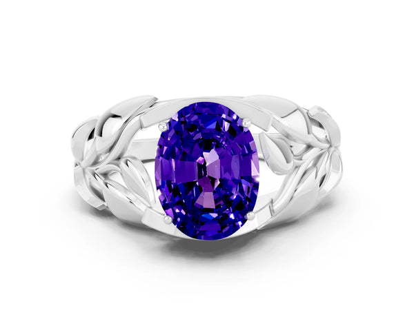 Silver Oval Cut Tanzanite Leaf-Inspired Engagement Ring with Round Accents and Prong Setting