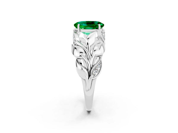 White gold Oval Cut Emerald Leaf-Inspired Engagement Ring with Round Accents and Prong Setting