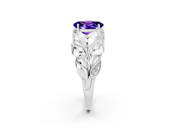 Silver Oval Cut Tanzanite Leaf-Inspired Engagement Ring with Round Accents and Prong Setting