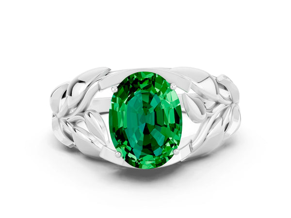 White gold Oval Cut Emerald Leaf-Inspired Engagement Ring with Round Accents and Prong Setting