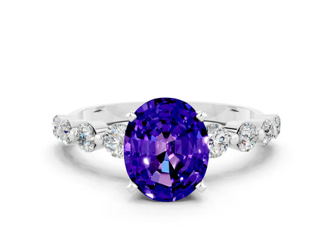 White gold Oval Cut Solitaire Tanzanite Ring with Pave Band and Four-Prong Setting