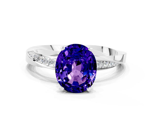 Platinum Oval Cut Tanzanite Engagement Ring with Side Stone Accents and Four-Prong Setting