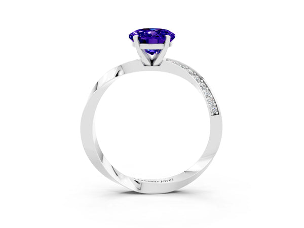 White gold Oval Cut Tanzanite Engagement Ring with Side Stone Accents and Four-Prong Setting
