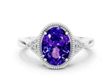 White gold Oval Cut Tanzanite Halo Ring with Tapered Band and Four-Prong Setting