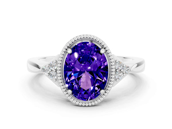 White gold Oval Cut Tanzanite Halo Ring with Tapered Band and Four-Prong Setting