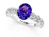 White gold Oval Cut Tanzanite Prong Setting with Side Stones on a Pave Band_1