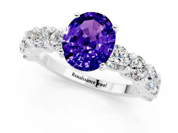 Platinum Oval Cut Tanzanite Prong Setting with Side Stones on a Pave Band
